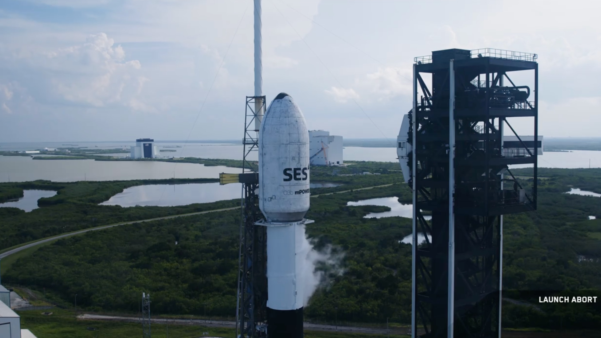 A SpaceX Falcon 9 rocket stands ready to launch two of SES' O3b mPOWER satellites on July 21, 2025. SpaceX called that day's attempt off.