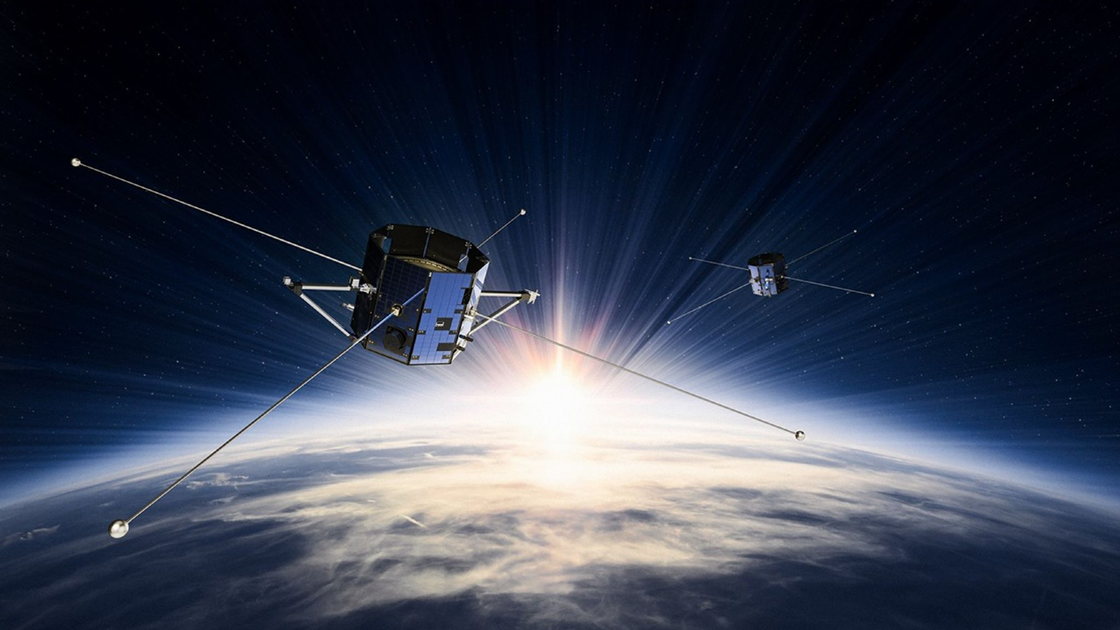 An illustration of two boxy satellites with long antennae floating above Earth in space