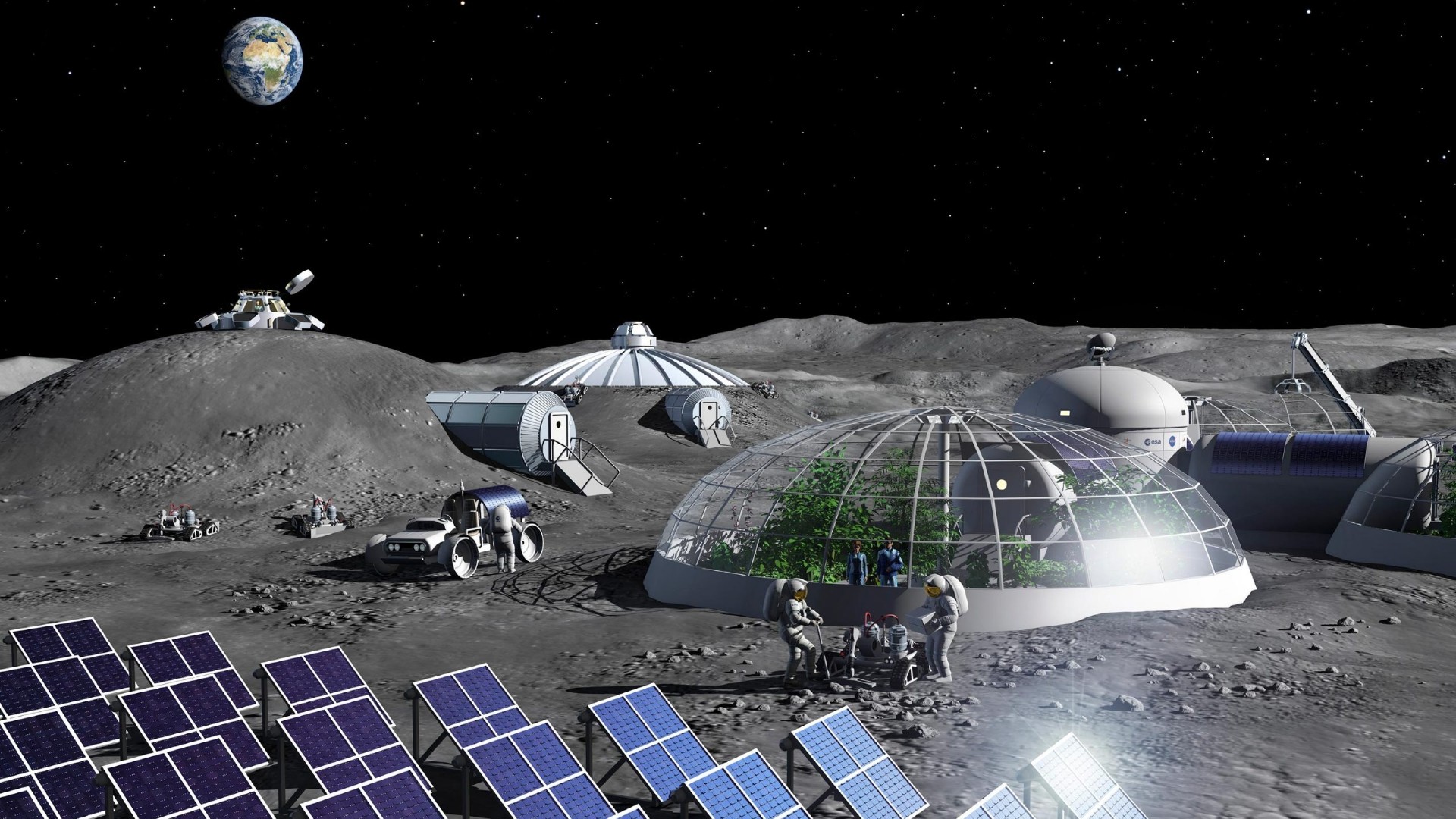 astronauts in bulky spacesuits walk on a dusty grey surface alongside arrays of square solar panels and glass domed habitats. earth can be seen in a black, starry sky overhead
